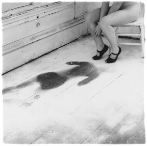 Eating the darkness songwriting inspiration Francesca Woodman body print black shoes woman floorboards empty room abandoned house self-portrait